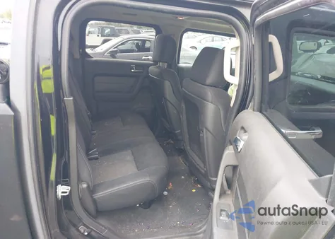 2009 Hummer H3T z USA, uszkodzony, nr VIN 5GNEN13E898128599